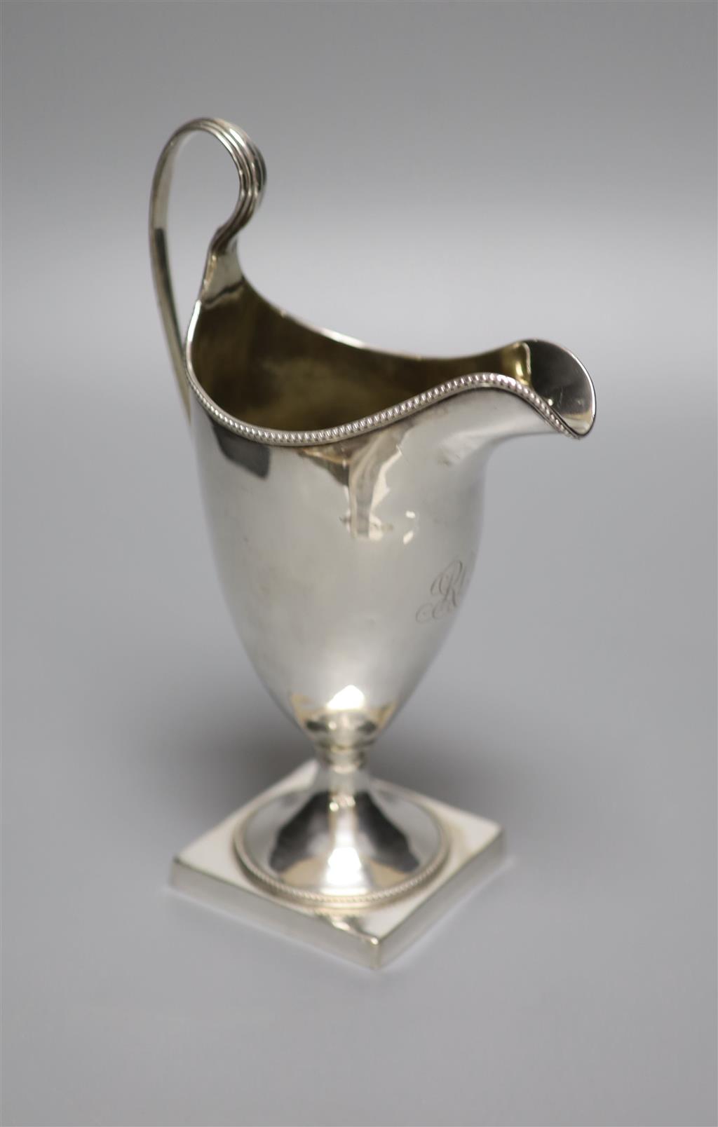 A George III silver helmet cream jug, indistinct makers mark, London, 1791, 20cm, 5.5oz.